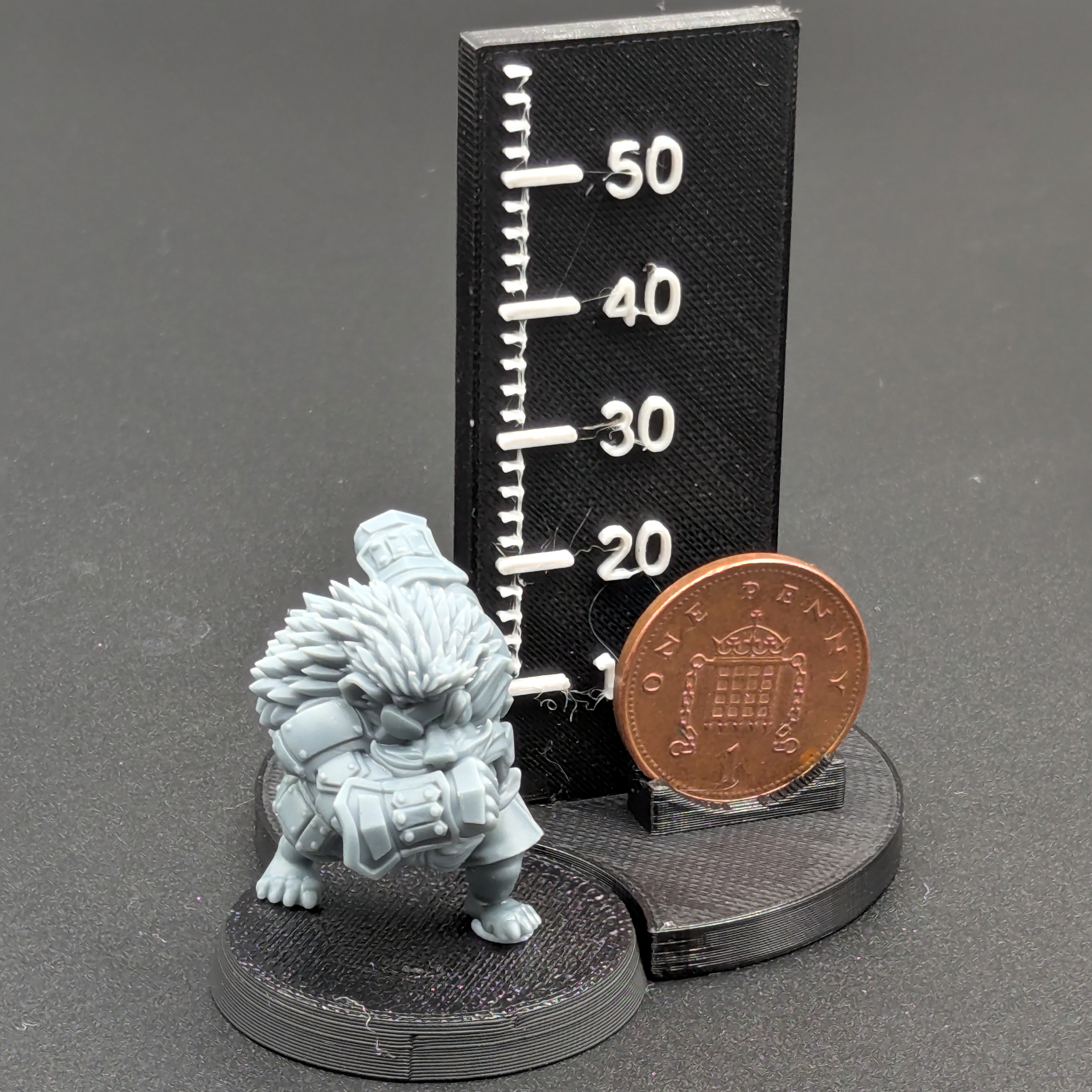 Old Forest Alliance Hedgehog Lineman. Printed in grey resin, next to a scale showing height with a UK penny as a reference.