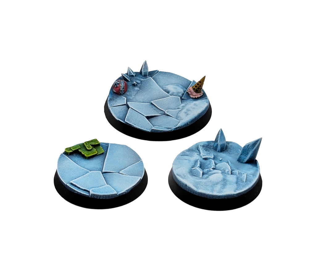 Three Ugni Frozen Scenic Bases from the Norse Fantasy Football team.  One in 40mm and two in 32mm. Shown painted on a white background.