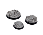 Three painted bases from the Txarli Rocky set on a plain white background. 25mm, 32mm and 40mm