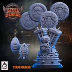A blue unpainted tabletop miniature sculpted as a bearded industrial figure with large circular medallion heads, shown on a dark illustrated background. The image includes the Steel Beards logo, a UGN logo, and the text 'TEAM MARKER' alongside smaller views of the figure and two separate round medallion pieces.