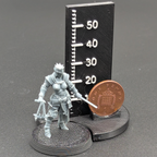 Bleeding Procession Stigmatic Nun with Sword and Flail. Printed in grey resin, next to a scale showing height with a UK penny as a reference.