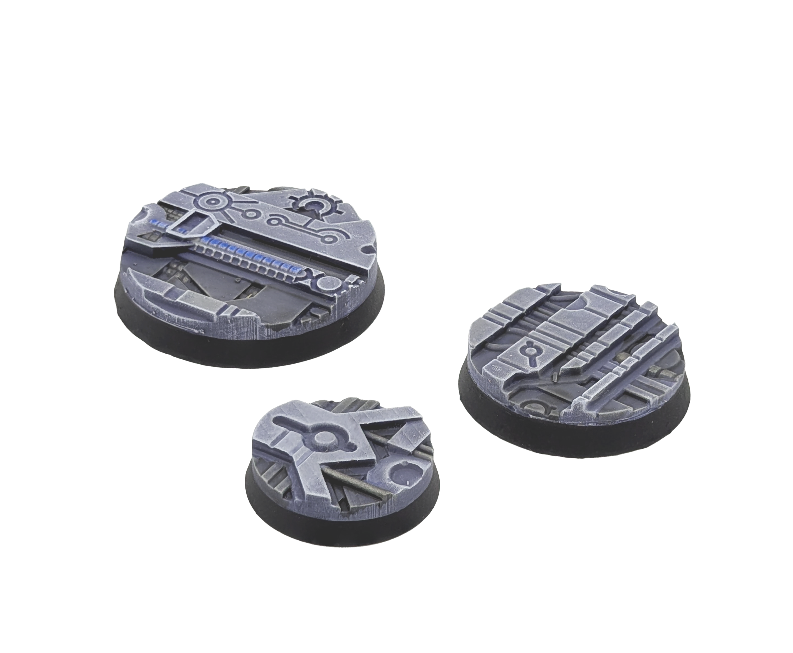 Three painted bases from the Txarli Xeno Tech set on a plain white background. 25mm, 32mm and 40mm