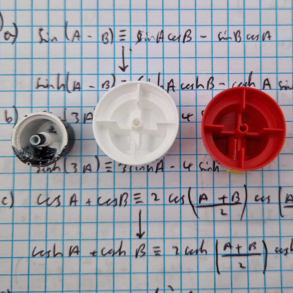 Photograph showing just the caps. Three different ones in different styles. One is very dirty and needs cleaning.